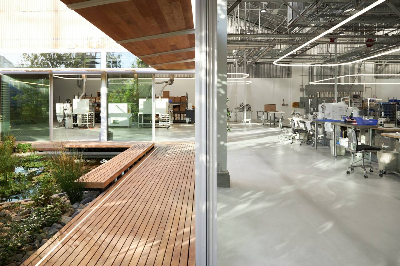 Set within an industrial Los Angeles neighborhood, KX Lab shrouds its unconventional tech-filled design within a typical warehouse exterior and sets out to change the way manufacturing is carried out in Los Angeles. The design focus supports a social mission where technology and people interconnect. 
<br><br>
The facility seamlessly merges a knit manufacturing space with workspace, research and development, retail environment, and exhibition space. KX Lab sees its new home as a prototype for “radically more humane” manufacturing environments focused on sustainability and transparency. As a local manufacturer, KX Lab aims to bring consumers, products, and the people that make them closer together.