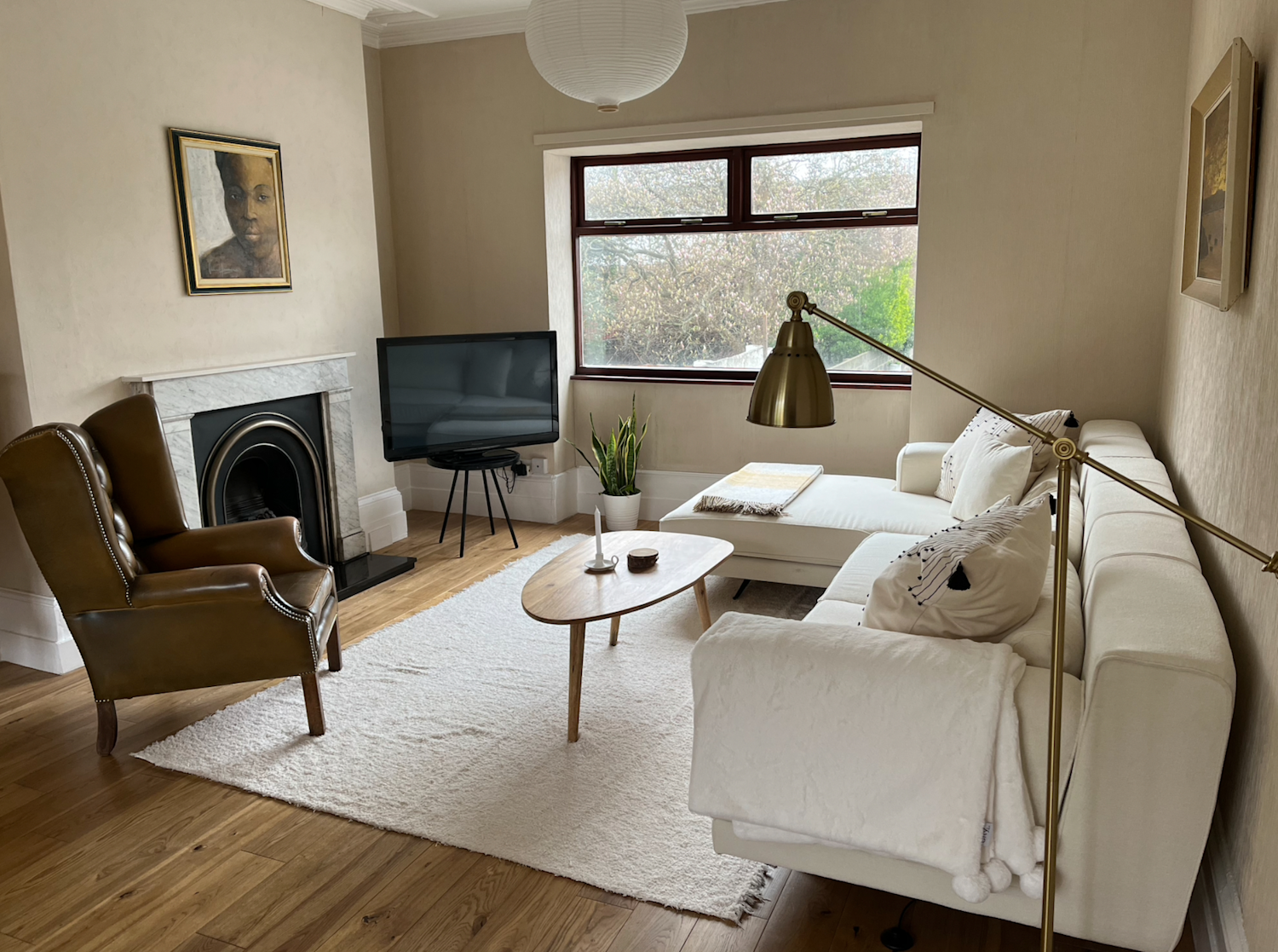 Stylish mid-century modern furniture and interior of a Georgian house overlooking a long garden