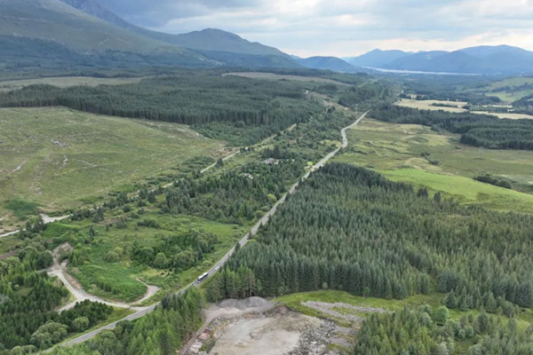 Aerial view of the landscape, with mountains in the background