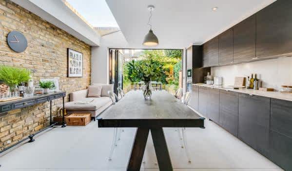A modern kitchen extension with skylight and bi-fold doors