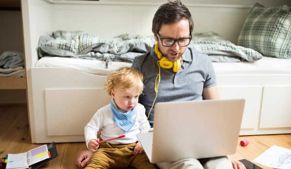 Impact of coronavirus on people renting: man browsing properties with toddler