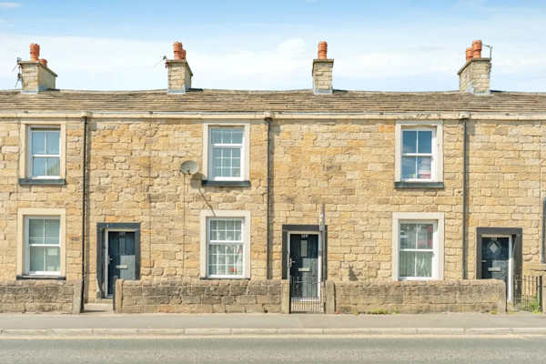 Row of pretty stone houses on Leeds Road in Nelson