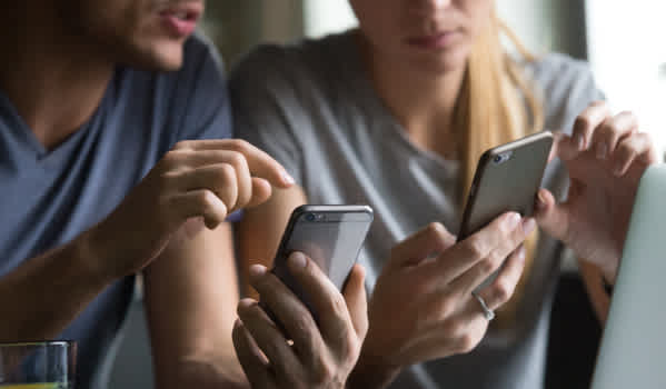 Couple looking at mobile phones