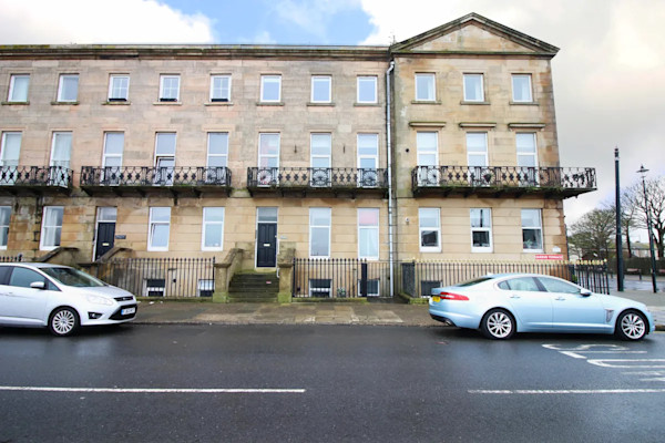 Stone building with ornate balconies near the seafront in Fleetwood