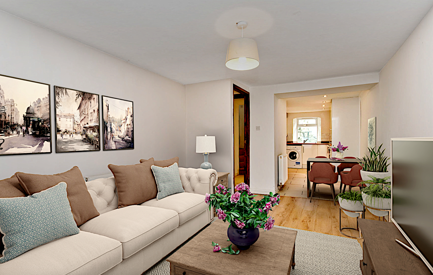 Inside the open plan kitchen and living area of a small but modern cottage with neutral fittings and computer generated furniture