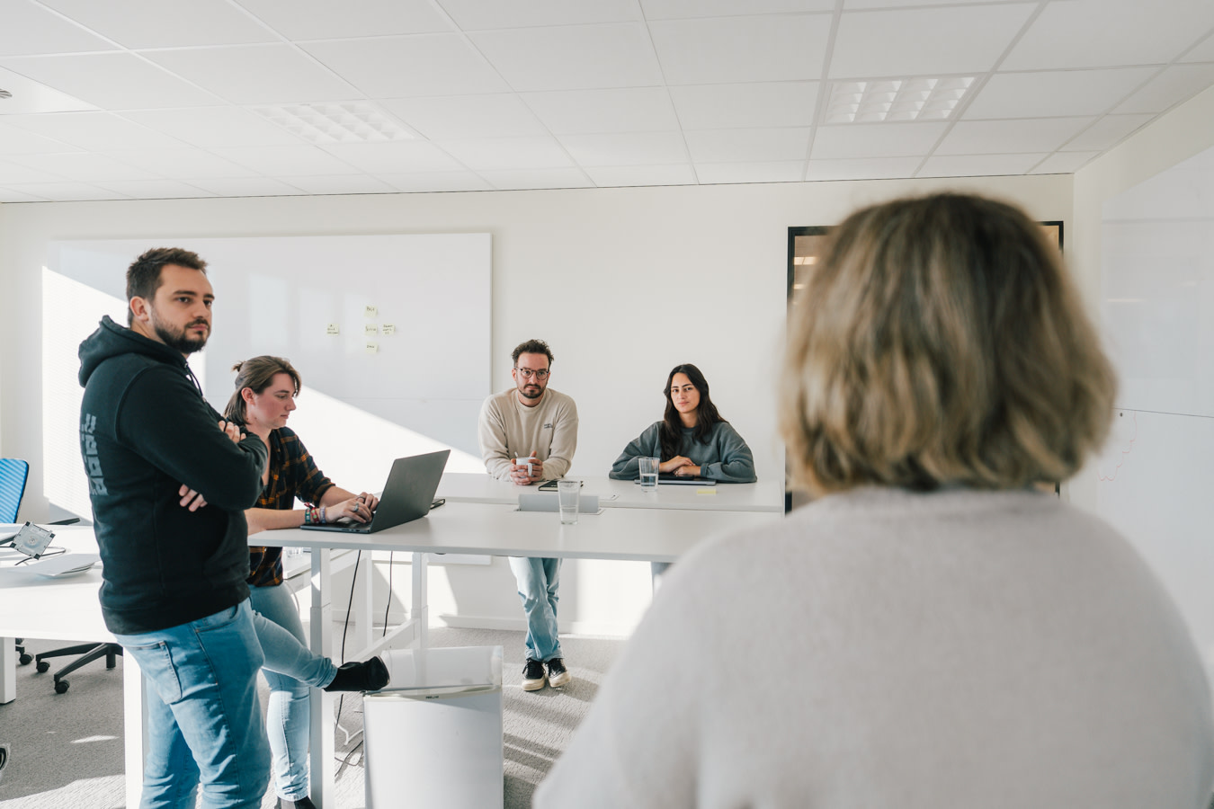 Image of a headless expert explaining a concept to a group of people