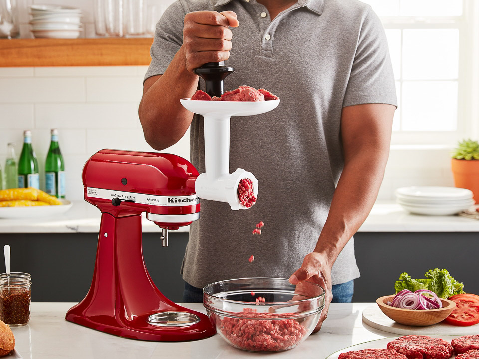 Mixer-attachments-meat-grinder-empire-red-man-using-meat-grinder