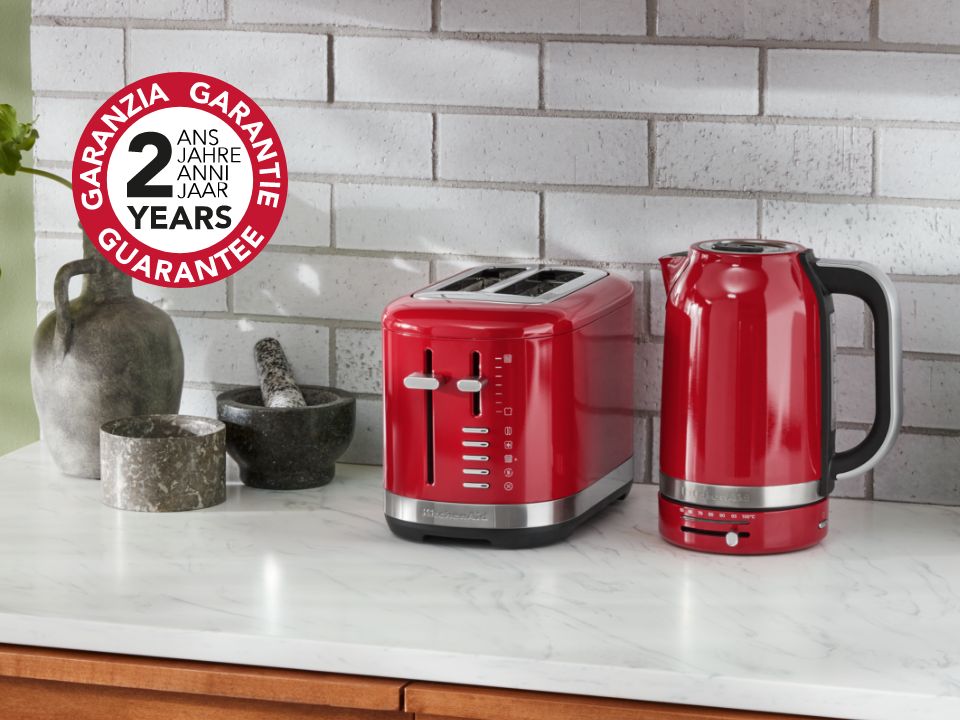 Toaster-2-slice-5KMT2109-empire-red-on-countertop-with-kettle