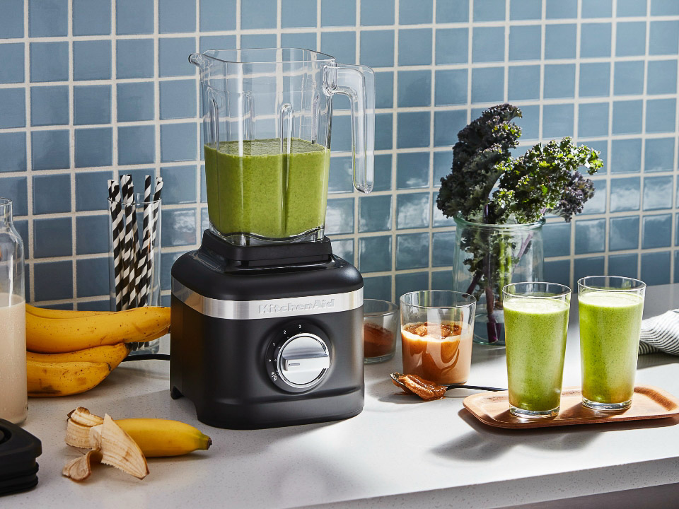 Blender-K150-iron-cast-black-on-countertop-with-green-smoothie