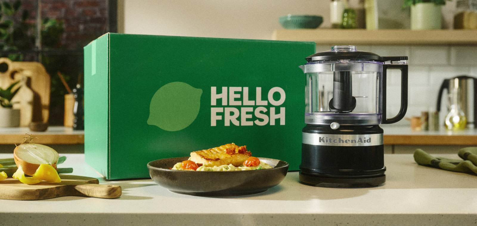 kitchenaid-with-hellofresh hero-banner-hellofresh-box-with-mini-food-pro-in-onyx-black-on-countertop