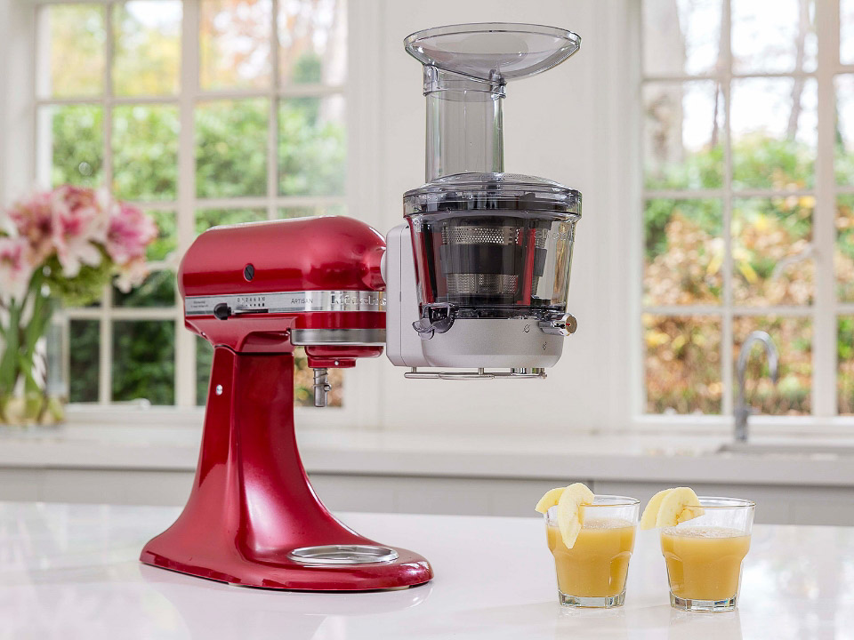 Mixer-attachments-slow-juicer-empire-red-with-juicer-in-the-kitchen