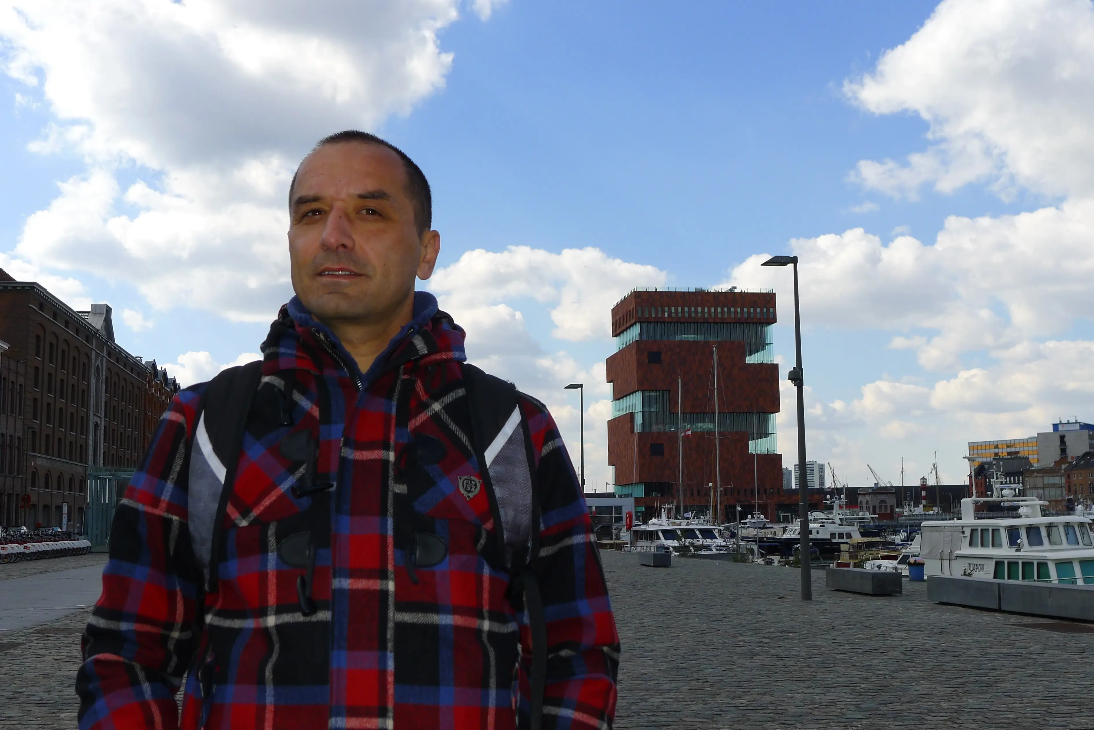 Petar Petkov in front of a building