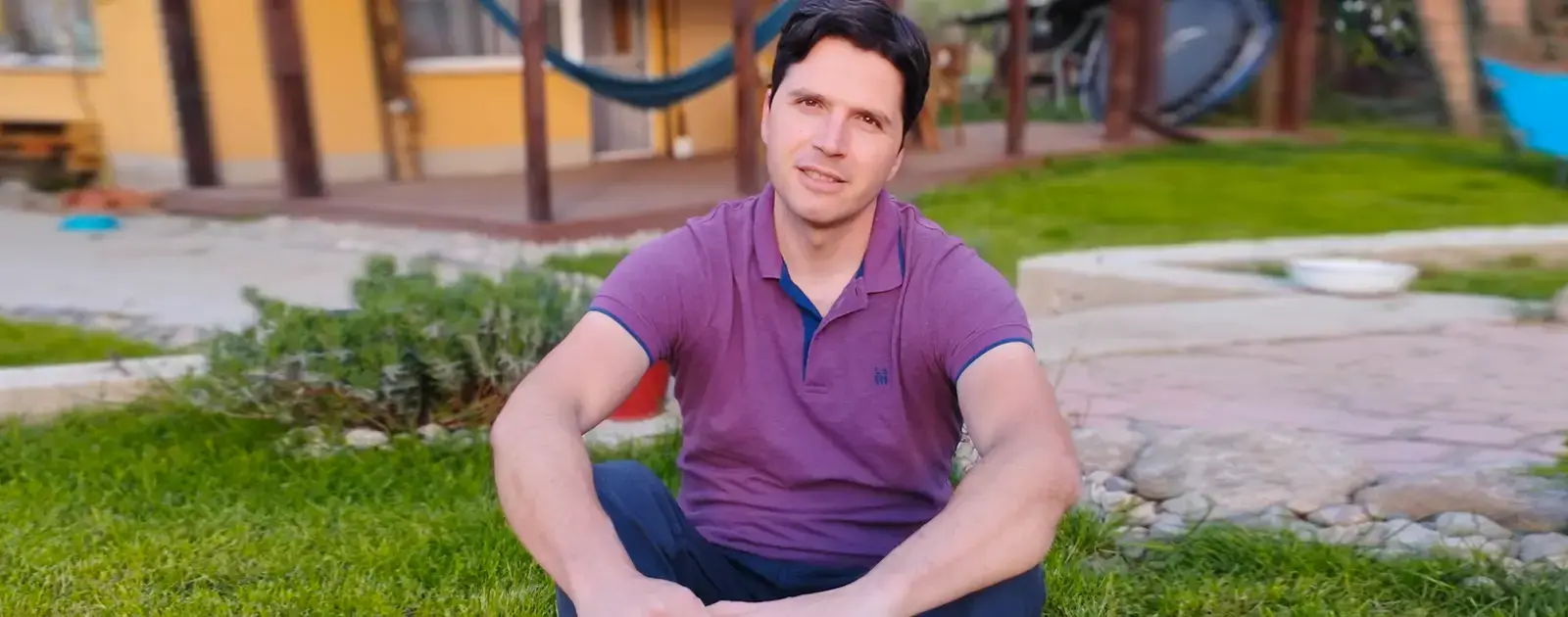 INDUSTRIA's Corda Team Lead, Nino Bonev, sitting outside his countryside home
