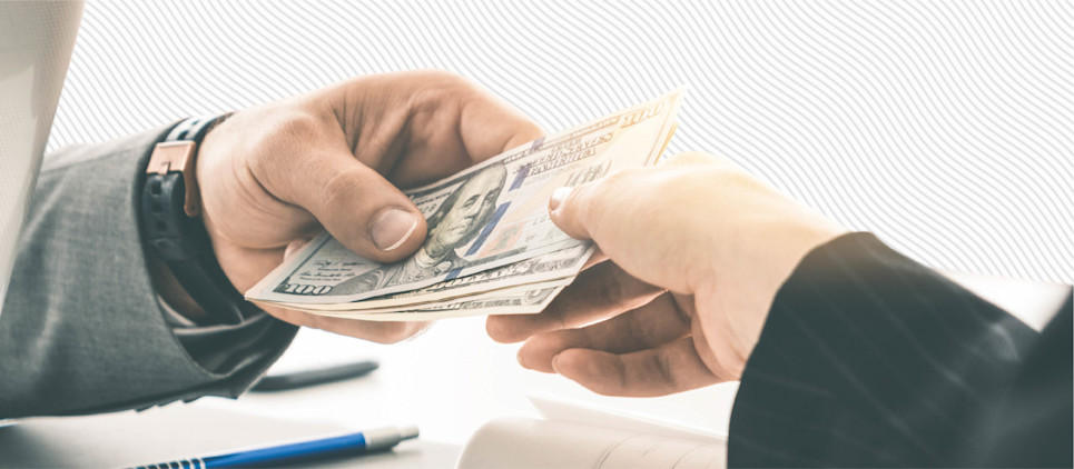 Hands of two people exchanging money.