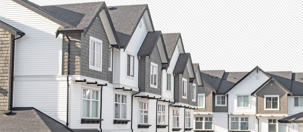 Remodeled white and grey row houses.