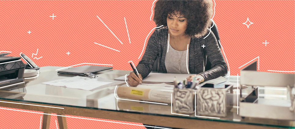 Woman working at a desk from a home office.