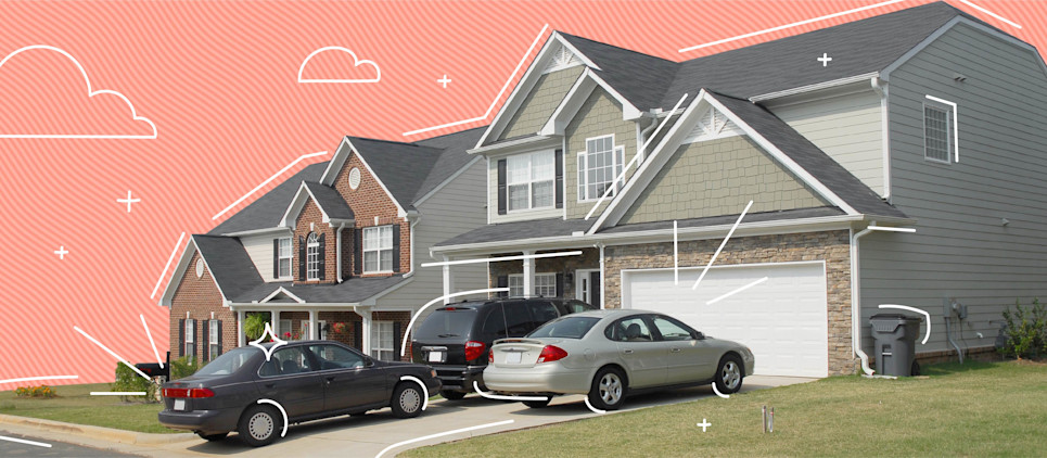 Three cars parked in a driveway in front of a home, two of cars are tandem.