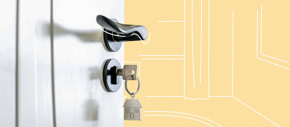 close up of door handle with inserted key on yellow background