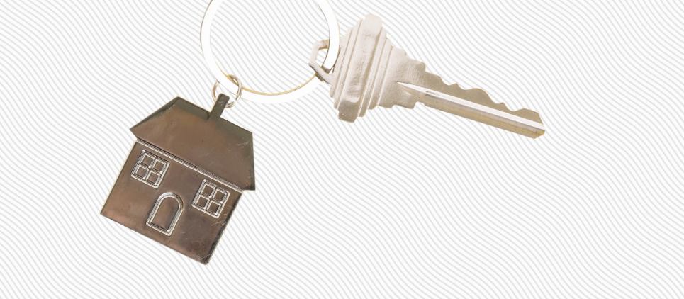 Key and key chain shaped like a house. 