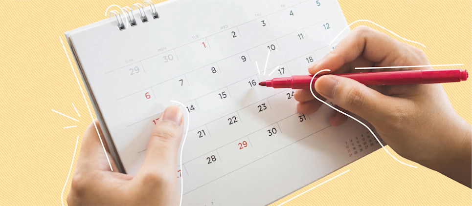 calendar of the month with a hand and pink pen directed towards the 16th, middle of the month, on a yellow background