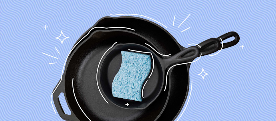 cast iron skillet stacked with a blue sponge in the middle all on a blue background