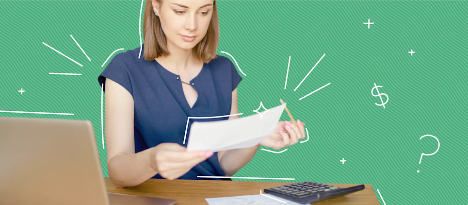 Woman looks at a piece paper holding a pencil with a calculator in front of her.