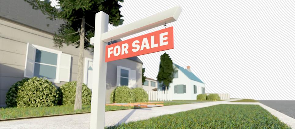 For sale sign in front of a house.