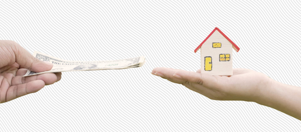 Two hands reach towards each other, one holding cash and one holding a miniature house figurine.
