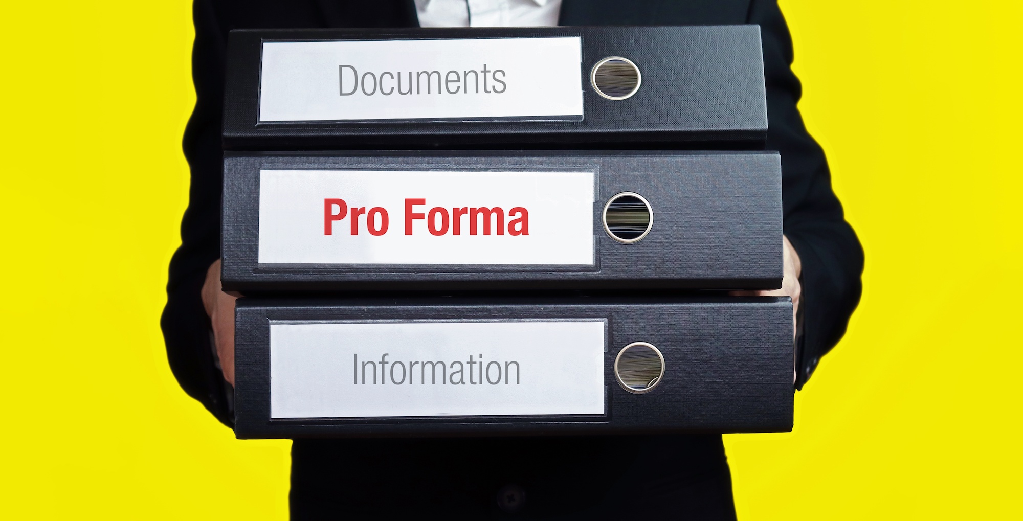 Stack of binders that read "documents", "proforma" and "information".