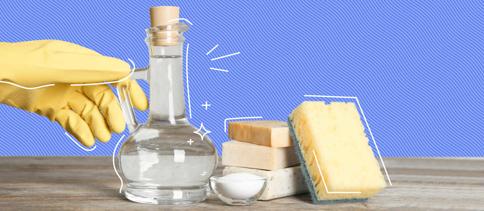 Someone reaching for vinegar and cleaning supplies