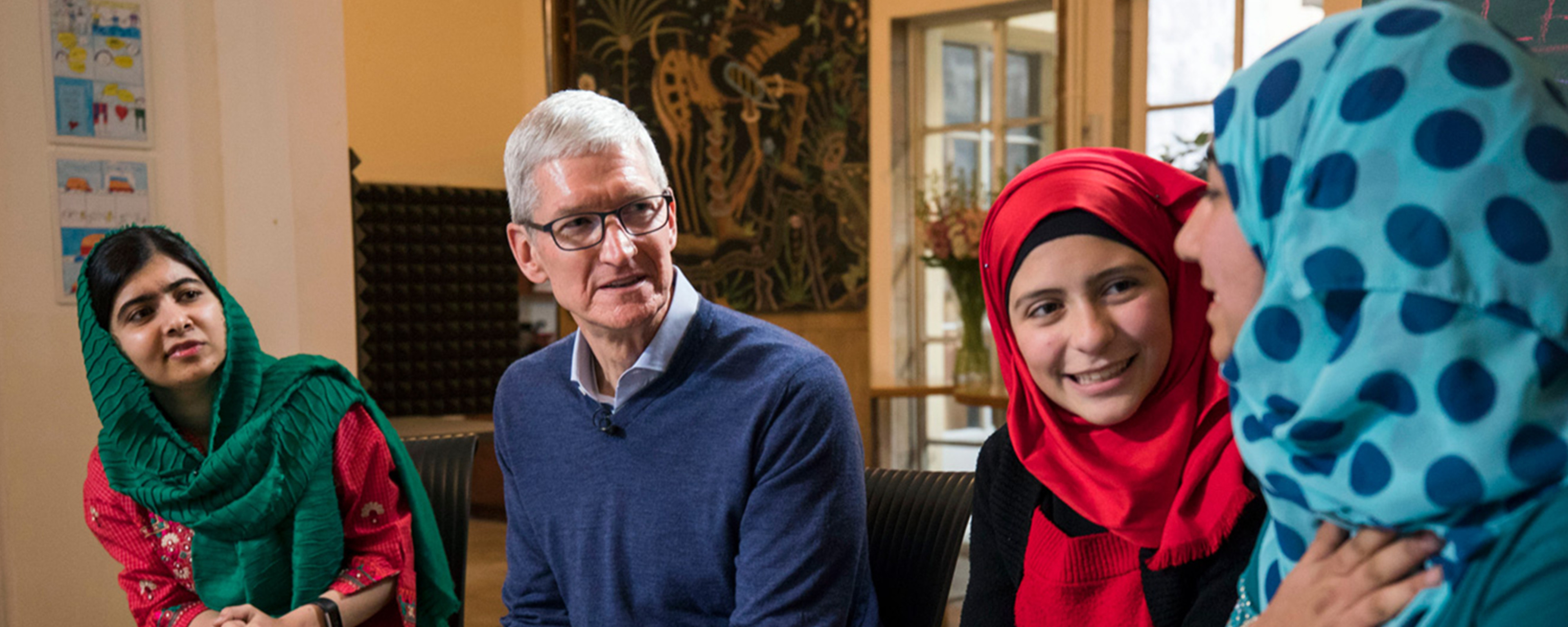 Tim Cook and Malala Yousafzai speak with Syrian refugee girls in Lebanon. 
