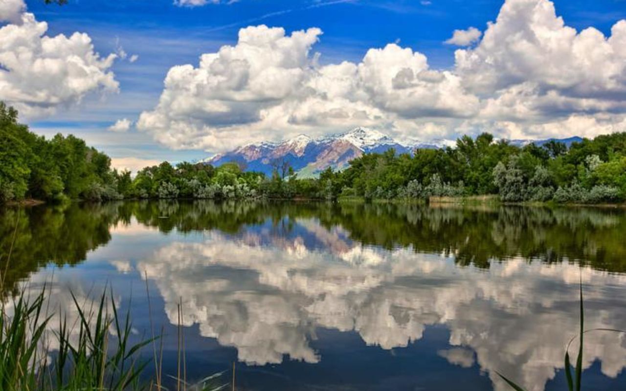 Ogden | Photo Gallery | 0 - Mountains reflecting on a pond in northern Utah