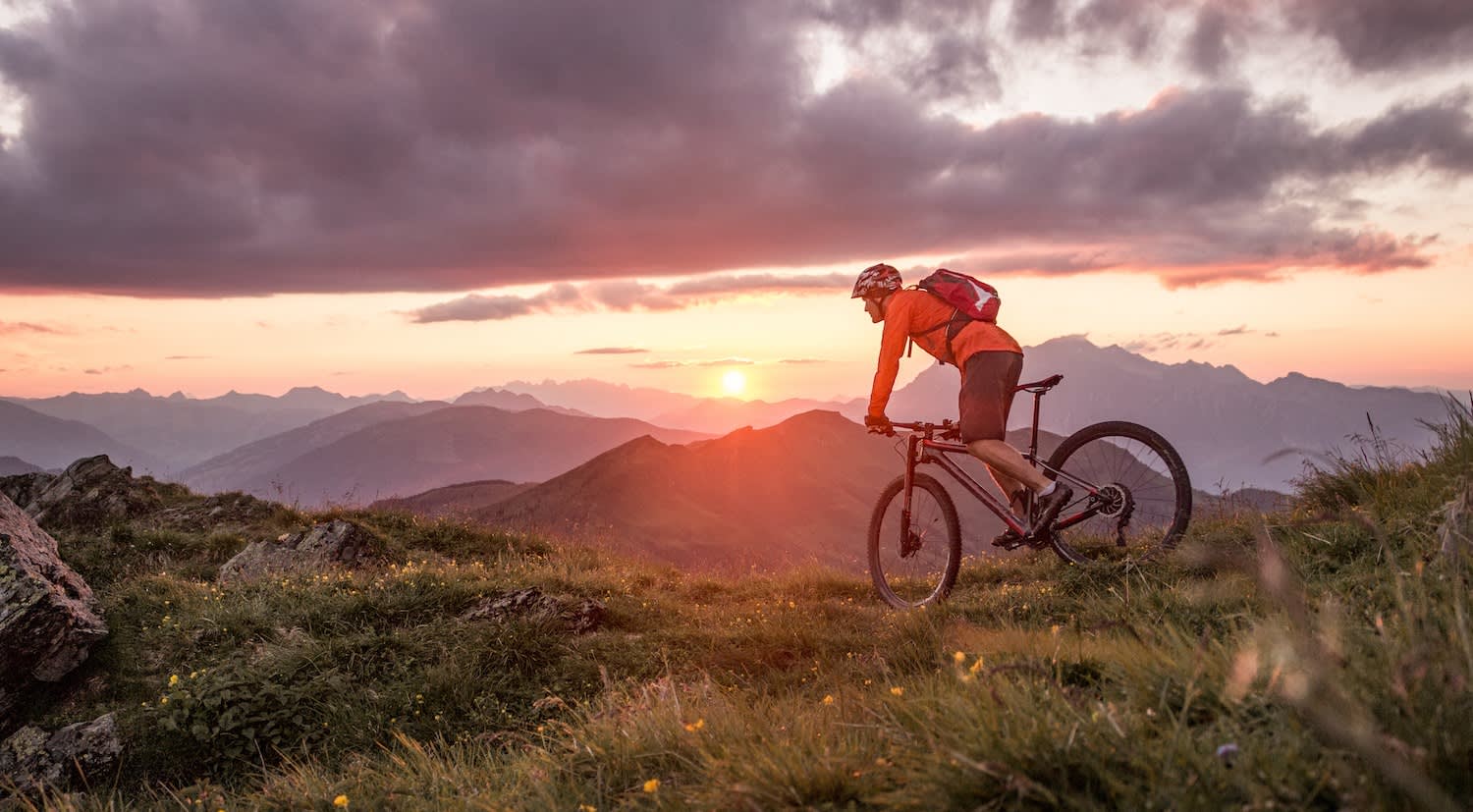 Mountain Biker on Mountain at sunset - Mountain Biker on Mountain at sunset