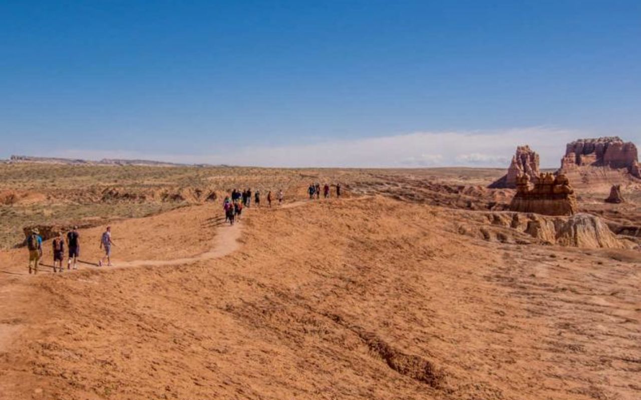 Goblin Valley State Park | Photo Gallery | 1 - Group of people hiking in Goblin Valley State Park