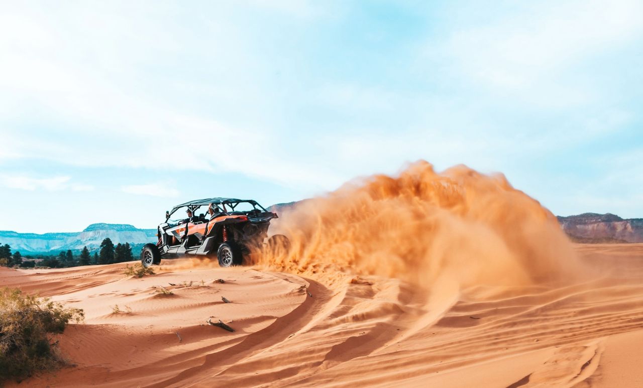 ROAM Outdoor Adventure Co | Photo Gallery | 1 - ATV Peek-A-Book Tour Take an adrenaline pumping ATV ride through sand dunes to one of the most beautiful and legendary slot canyons in the area!