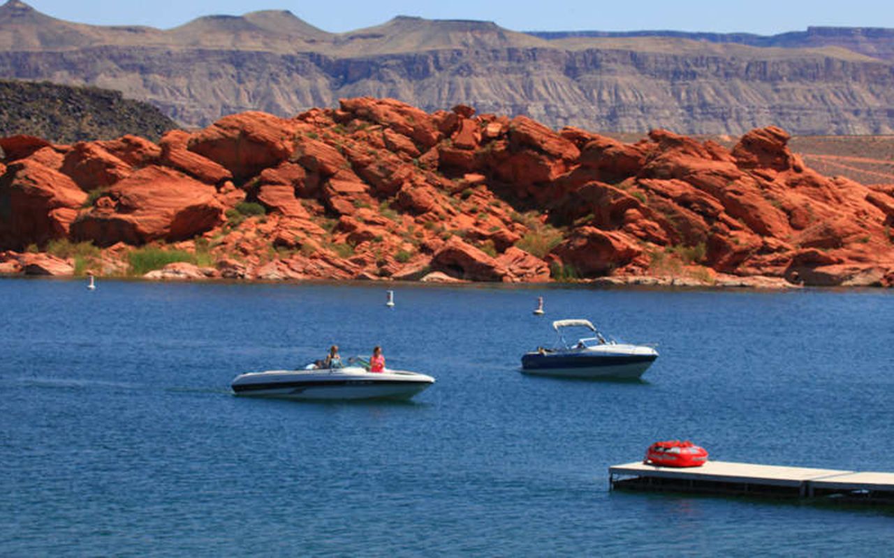 Sand Hollow State Park Boating | Photo Gallery | 0 -  Red rock and red sand meet warm, blue water at this state park, which is one of the most popular in Utah. his is a great place to camp, picnic, boat, fish and ride ATVs.