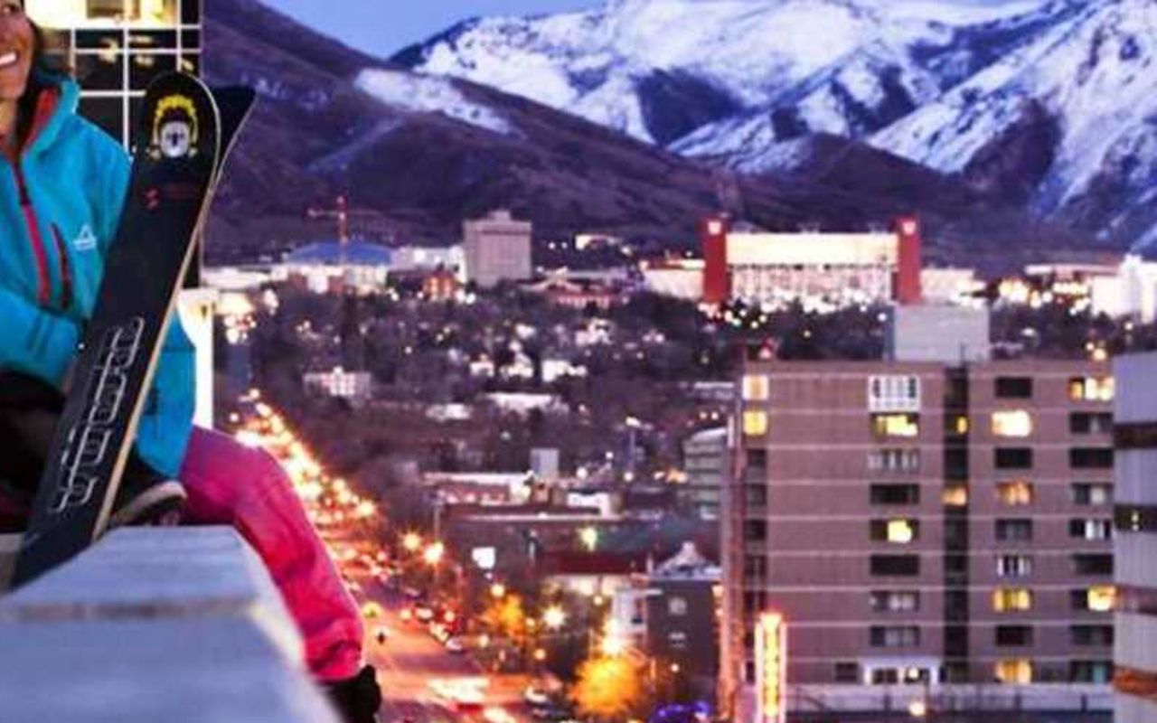 Wasatch Front Region | Photo Gallery | 0 - View of downtown Salt Lake City with snow covered peaks and full moon in the background.