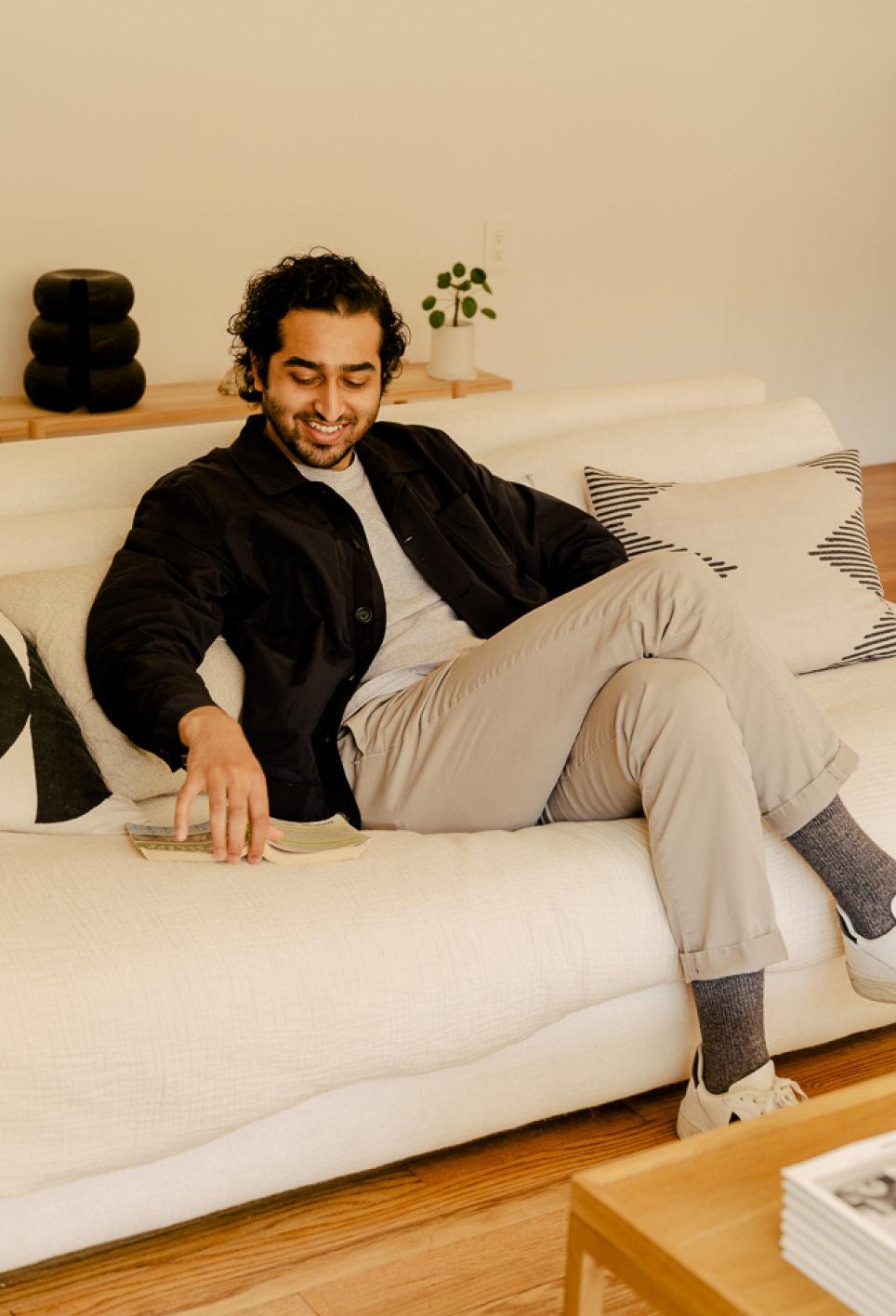Photo of a man sitting on a white couch
