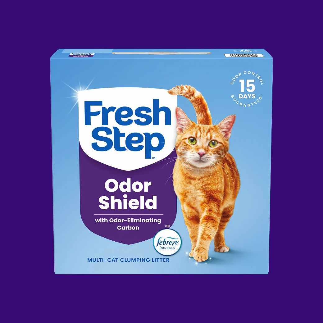 A carton of Fresh Step Odor Shield on a purple background