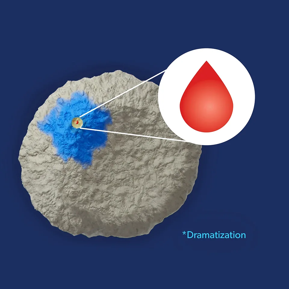 A piece of cat litter with a blue spot on it that indicated blood in the urine
