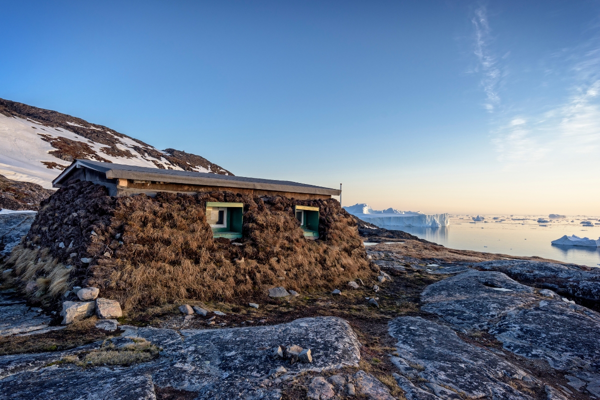Permanent traditional Inuit house along coast of Greenland