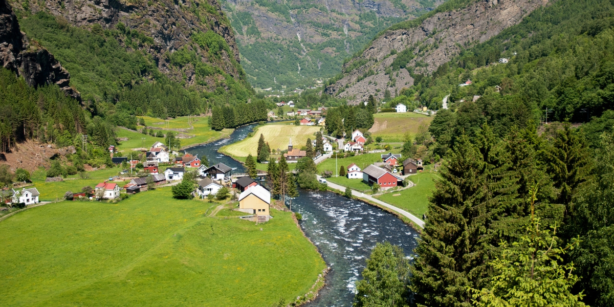 View from Flåm Railway of Flåmselvi River flowing through Norwegian village in Flåm, Norway