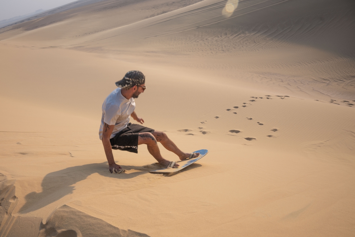 Sandboarding down the dunes in Wadi El-Rayan. (Photo: Matias Sepulveda)