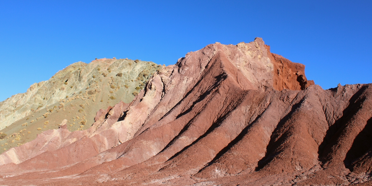 Red, green, and white rock formations, mountains in Rainbow Valley, Atacama Desert, Chile