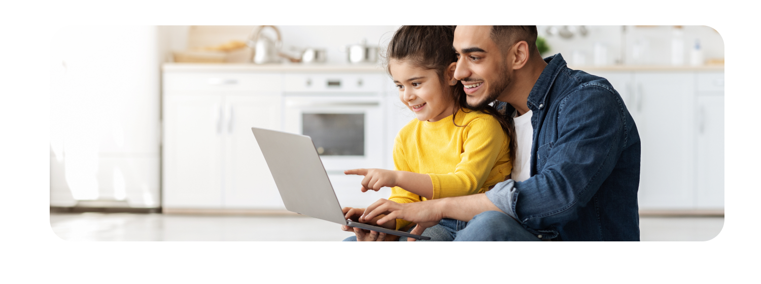 Father and daughter on laptop