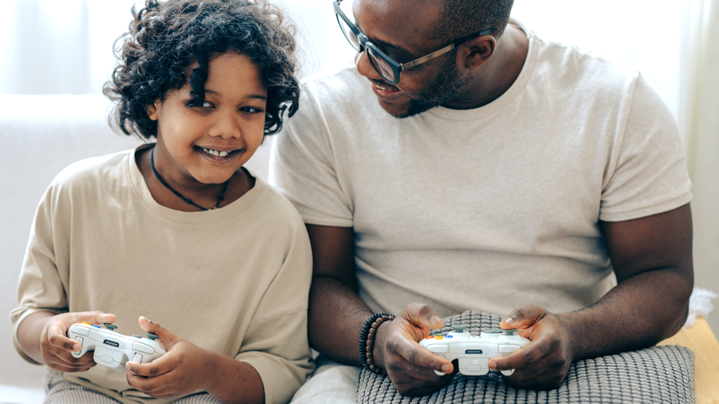 Father and child playing games online