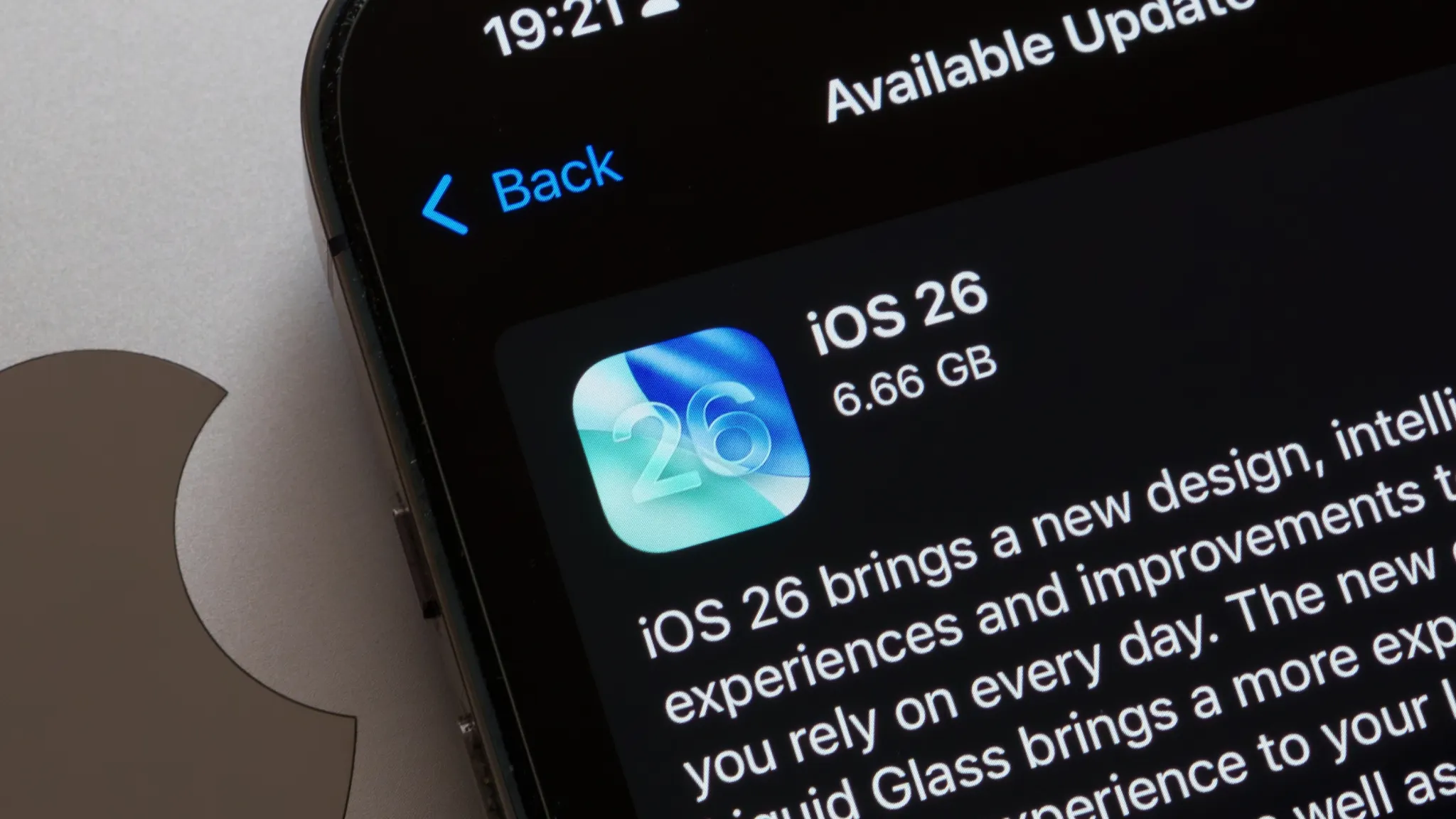 iOS 26 Liquid Glass interface on iPhone, illustrating how to fix display issues by adjusting motion and transparency settings
