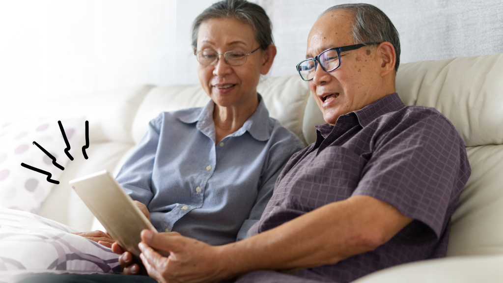 Senior couple looking at tablet