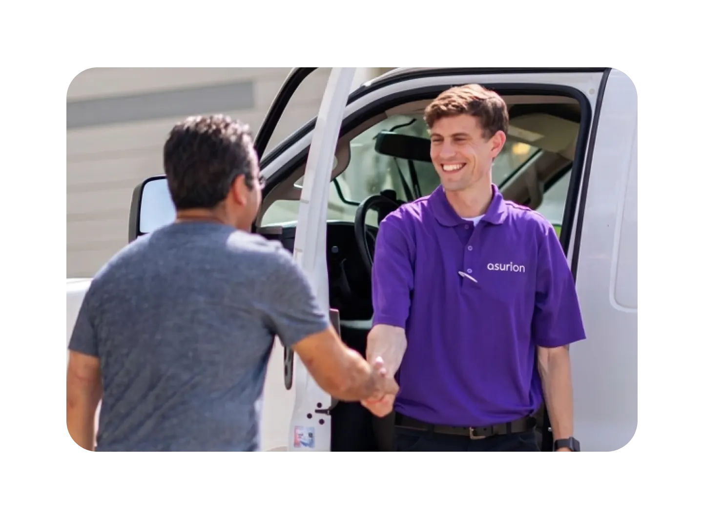 Asurion employee in a purple shirt shaking hands with a customer