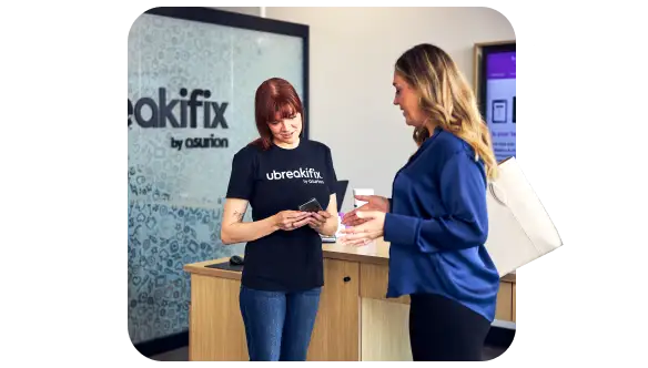 Employee helping a customer